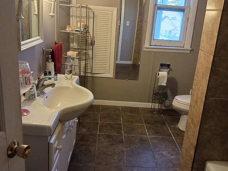 Full Bathroom on the upper level serving three bedrooms.