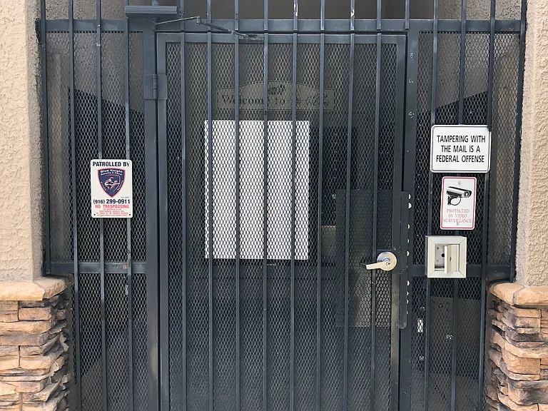Locked and gated Mailbox room.