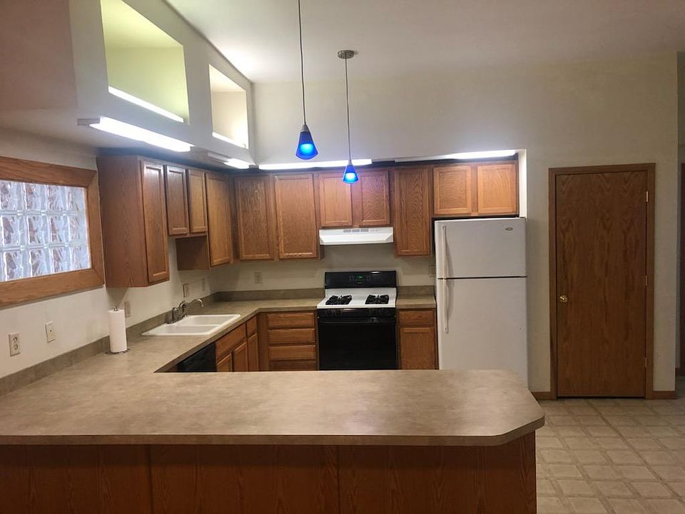 Luxury Kitchen with lots of cupboard space. The bar overhangs and you can use barstools for breakfast bar. Specialty lighting makes for elegance at every turn.