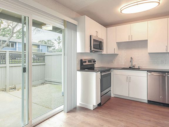Kitchen with Stainless Steel Appliances and Private Patio