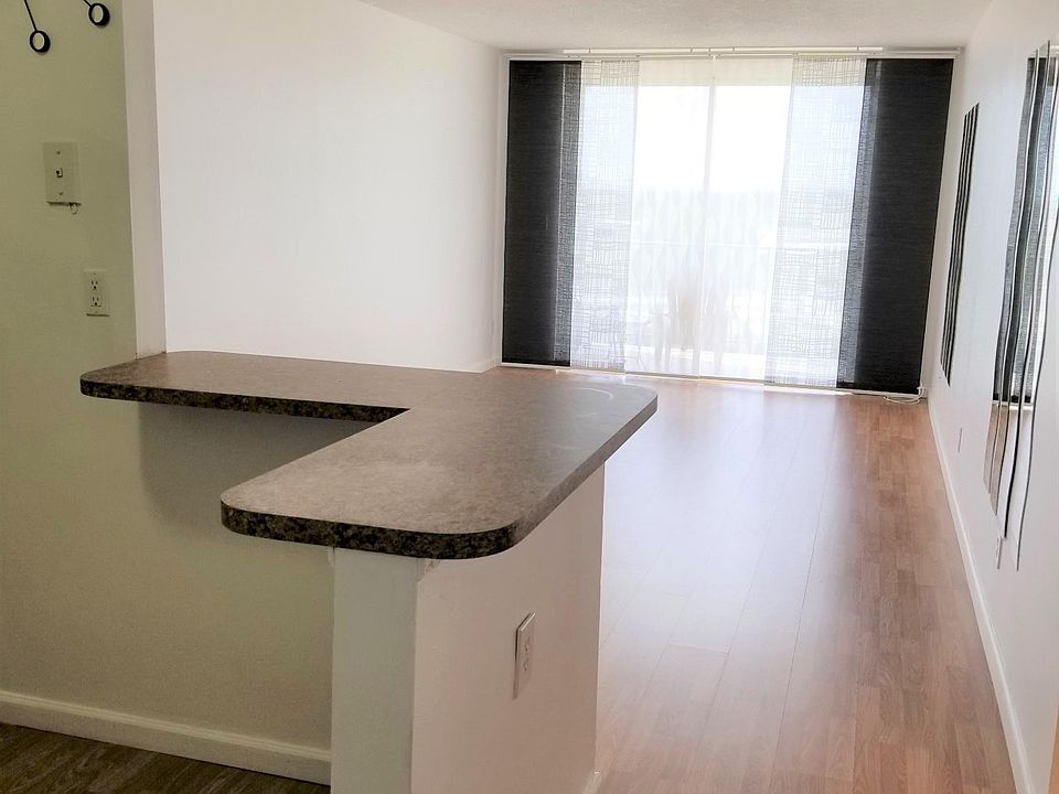 An open-concept layout connects the kitchen to the living room.