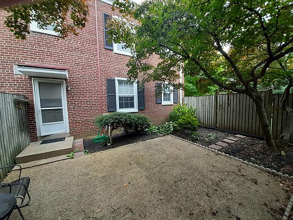 Private interior fenced garden, 30 X 18 feet patio aprox. photo 2023, two sherri blossom trees, perennial bushes, flower beds around, patio for family and private gatherings during three seasons.