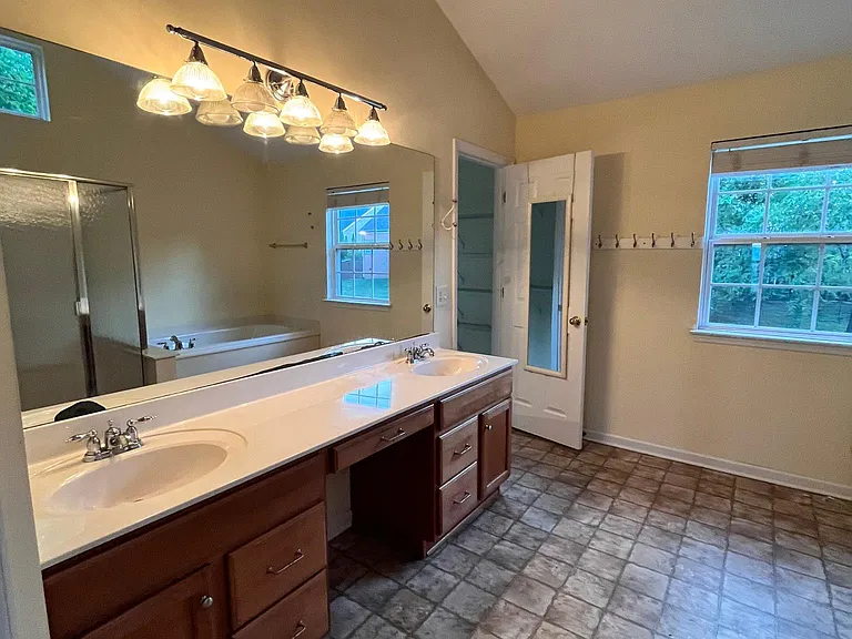 Master Bathroom with spacious closets on both sides