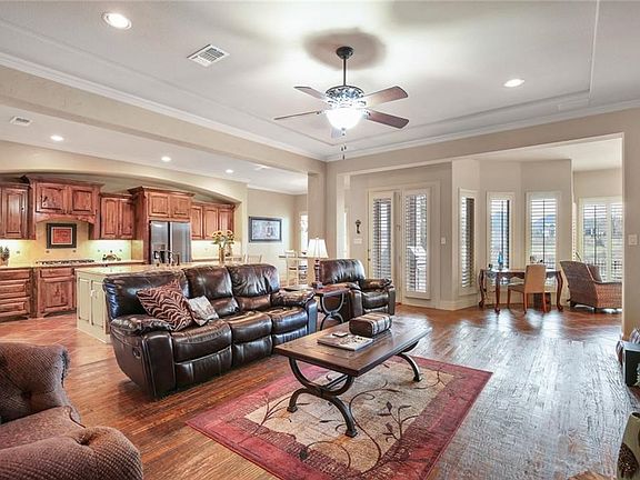 Great open floor plan with tray ceiling and double crown molding.  Plantation shutters abound!