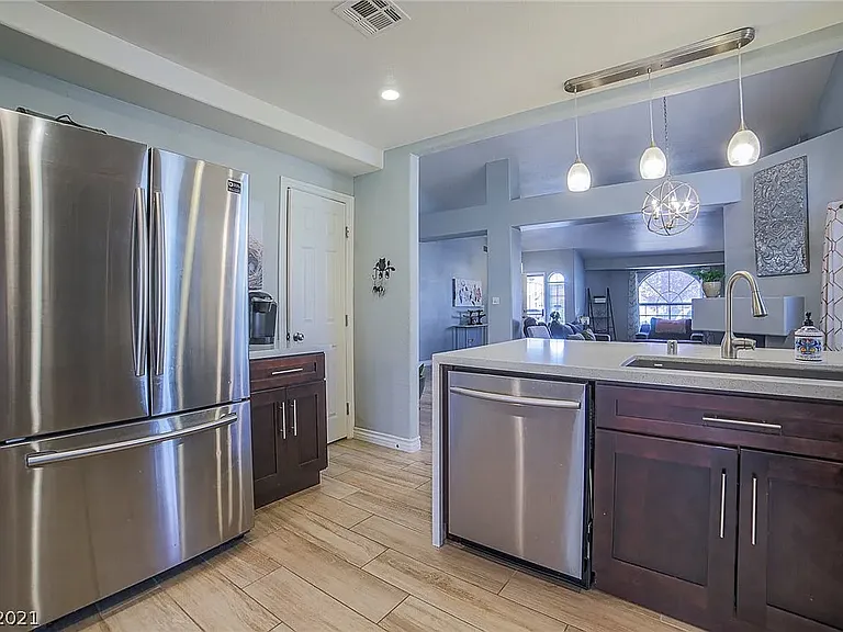 Kitchen, pantry door next to coffee bar.