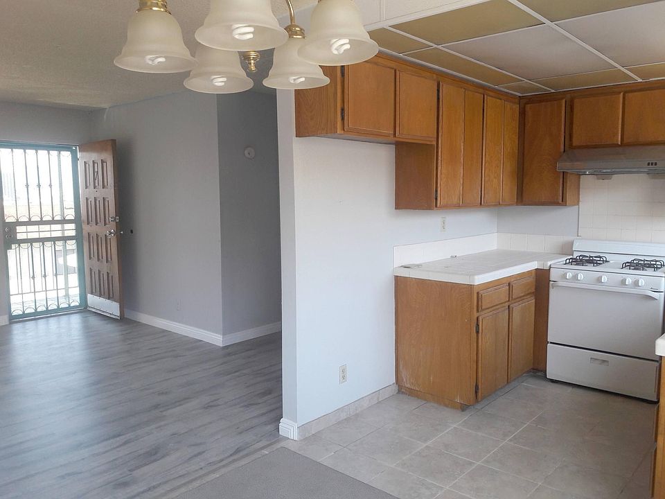 Front entrance and kitchen viewed from southeast livingroom area.
