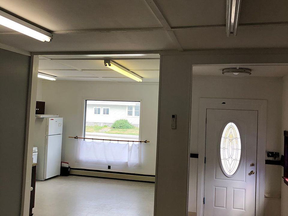 Looking from living room into kitchen and entryway