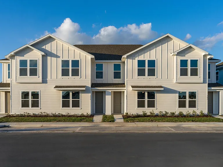 These spacious townhomes feature three bedrooms and attached garages, providing plenty of space for residents to spread out and relax.