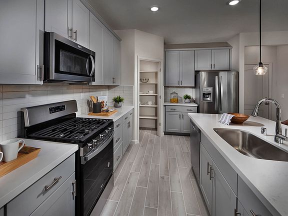 Residence 1 kitchen modeled at a nearby Meritage community.