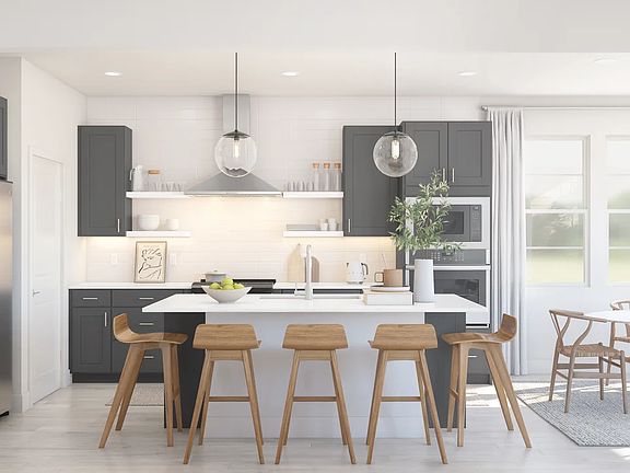 Kitchen with floating shelves and pendant lighting