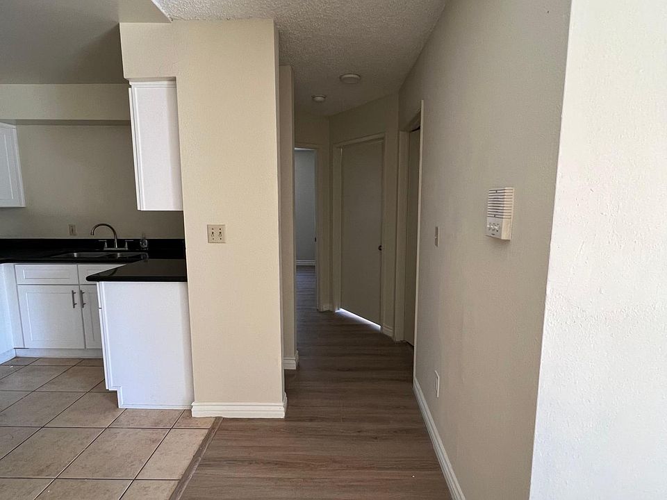 Centryway from living room leading to kitchen and bedrooms/bathrooms.