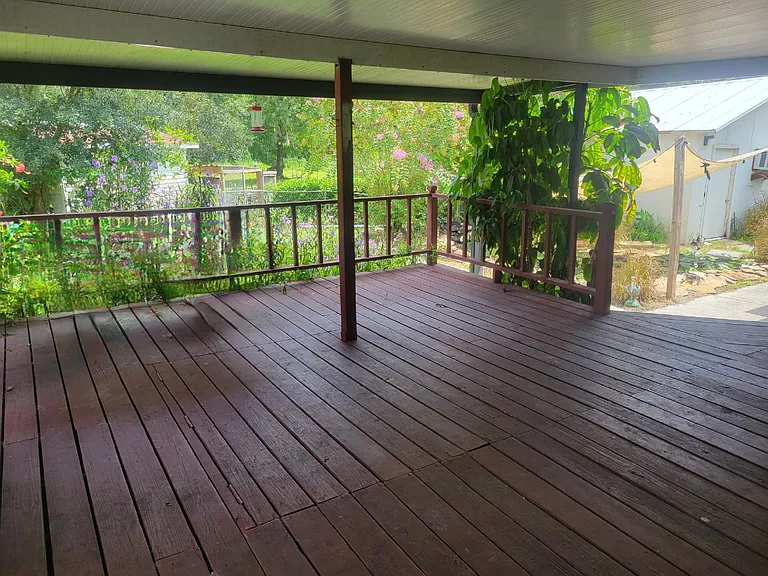 Large 20 x 20 covered patio that over looks 1.3 acres of land with fully stocked Koi Pond and fenced yard that backs up to the woods.