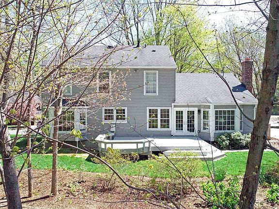 Deck overlooks private yard