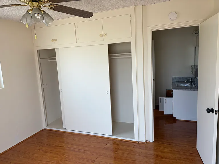 second bedroom with closet and extra storage on top.