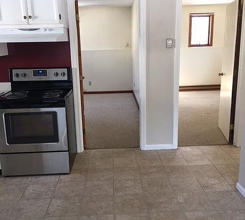 View of bedrooms from living room. Carpet in bedroom on the right now has laminate flooring.