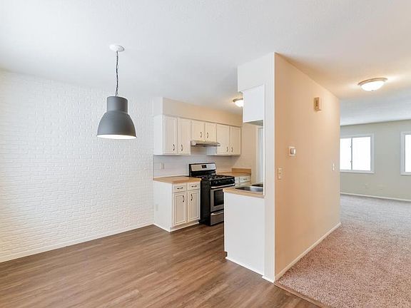 Dining area, kitchen and living room.