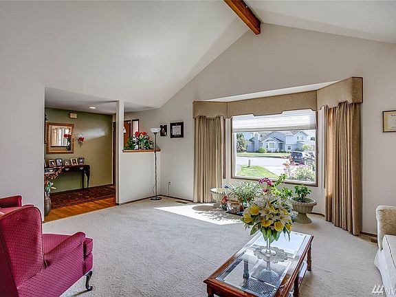 Vaulted ceilings and a huge picture window give this living room an open airy feeling 