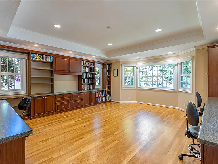 Library/Study Room with built-in shelves and desk for 4, ideal for study or work-from-home needs