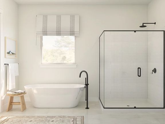 Primary bath with glass shower enclosure freestanding soaking tub