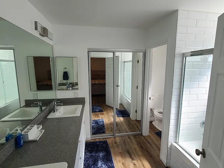 Retreat and recharge_this main bathroom features dual sinks and a spacious soaking tub, perfect for unwinding after a long day on the greens. ___