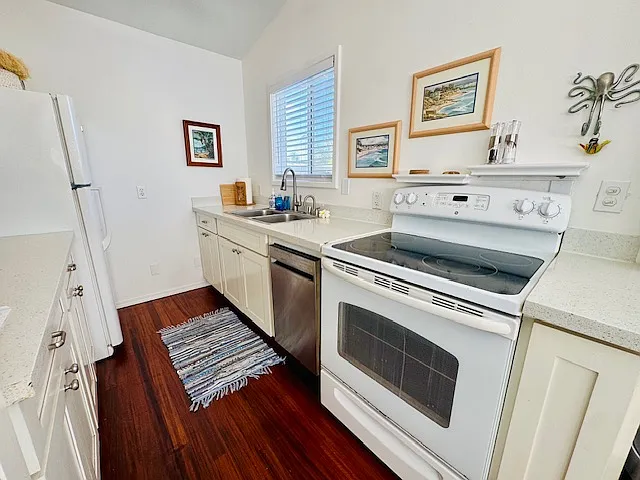 Full kitchen with large microwave, apartment size dishwasher, hot water dispenser, all dishes, cookware, Nespresso machine, food condiments included.