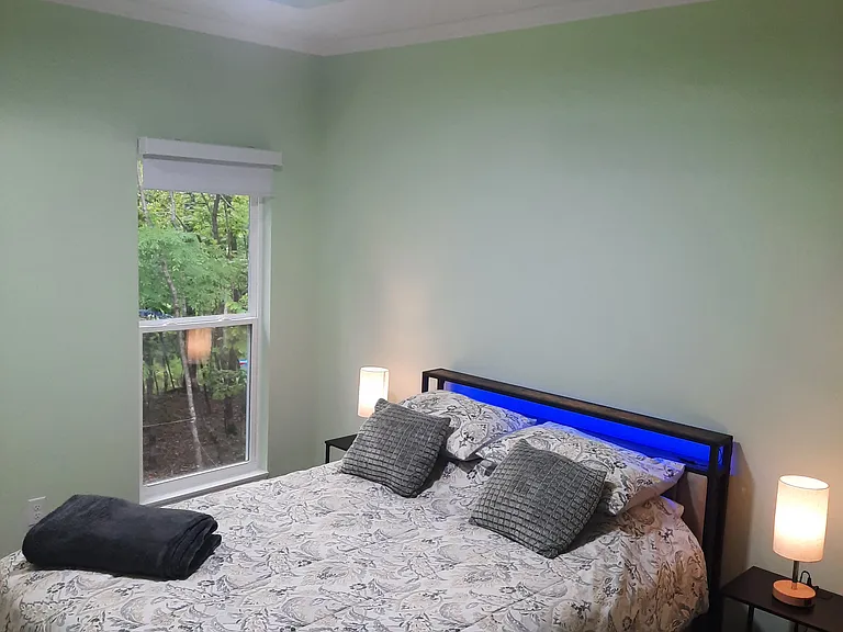 Master bedroom, Queen size fully dressed. Lots of built in USB ports. Light blocking roller shades.