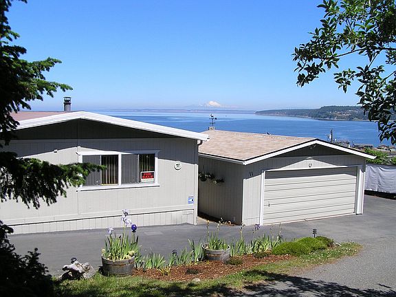 House & Garage with Discovey Bay & Mt. Baker in background.