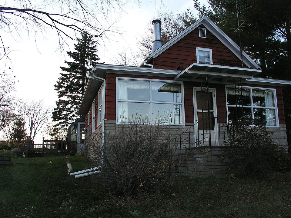 Heated greenhouse on left