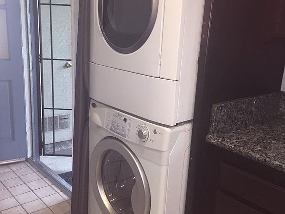 Full size washer and dryer located in kitchen