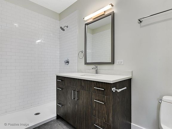 Frameless glass doors installed in shower.