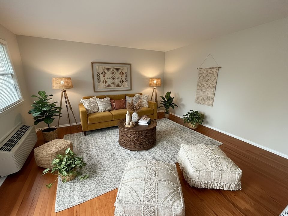 Digitally Staged- Living room at Duke View Apartments. Beautiful and spacious and ready for you to make your own with these Amazing hardwood floors.