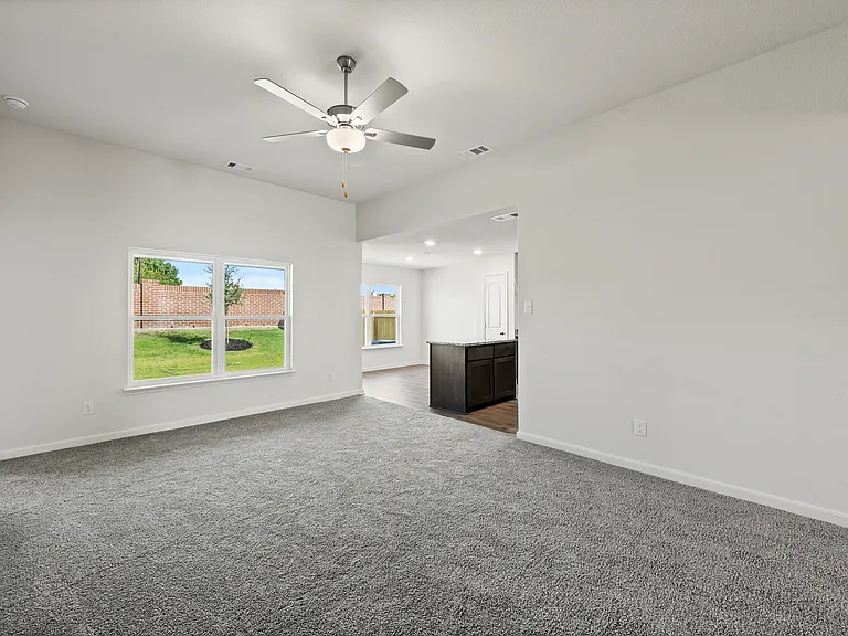 The family room sits right off of the kitchen and dining room creating an open-concept layout.