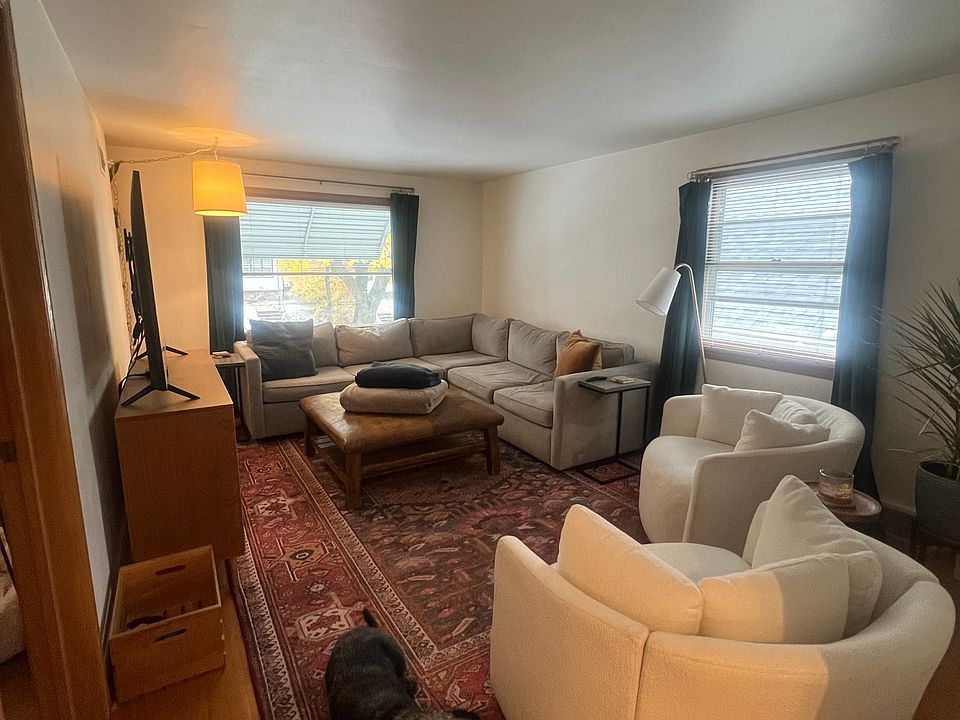 Large living room with built ins and wood floors