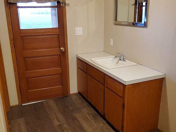 This entryway faces the east coming into the home. Yes, you are seeing a sink in the entryway! Across from the sink is a spacious closet for your coat, shoes and other items you may need to have in the closet.