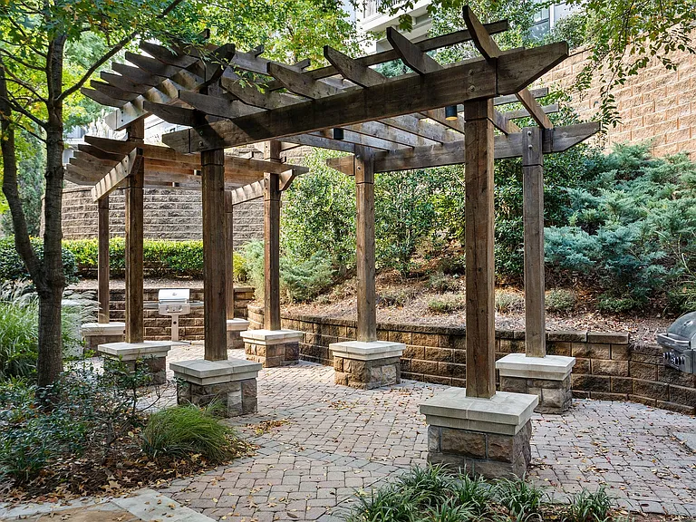 Experience tranquil outdoor living with this cozy patio, perfect for entertaining and relaxation.