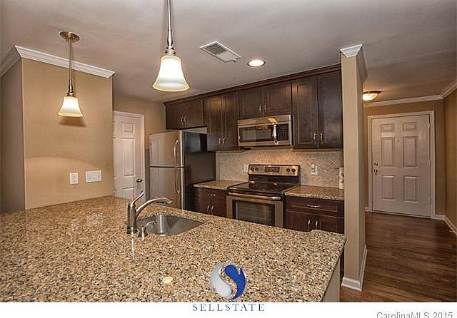 Beautifully updated, better than new kitchen with pantry and laundry room to left of refrigerator.  All appliances remain, including the brand new washer/dryer!