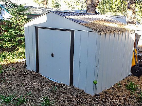 New metal shed included