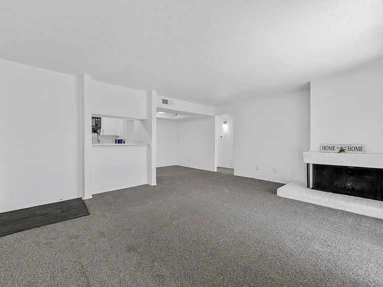 Spacious open floor plan with access to kitchen and fireplace