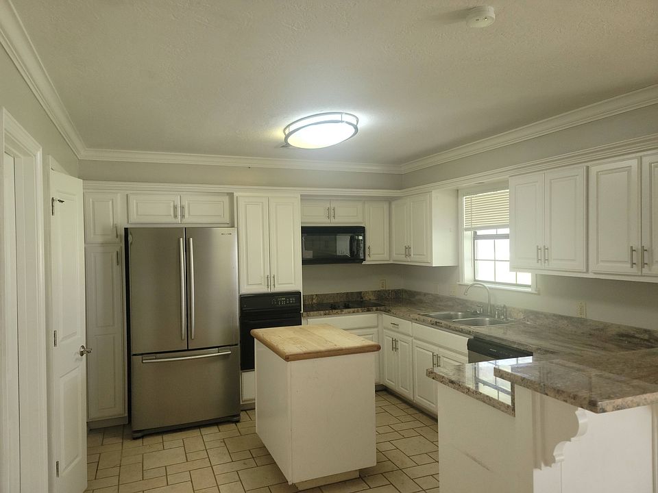 Kitchen with lots of cabinets and a pantry closet
