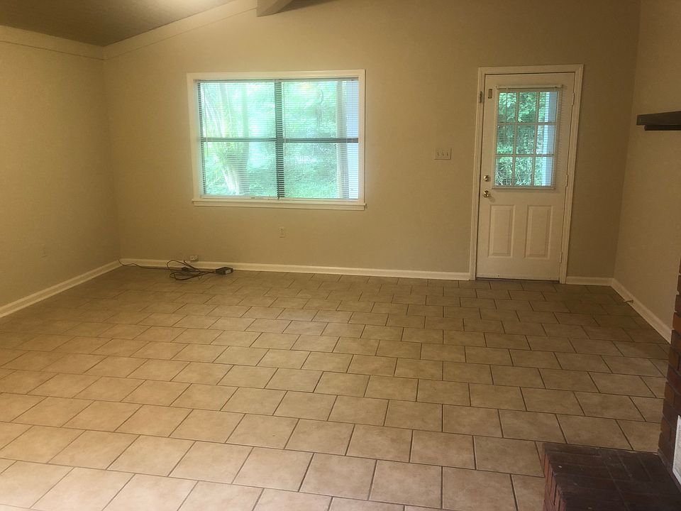 Very large living room with fireplace.