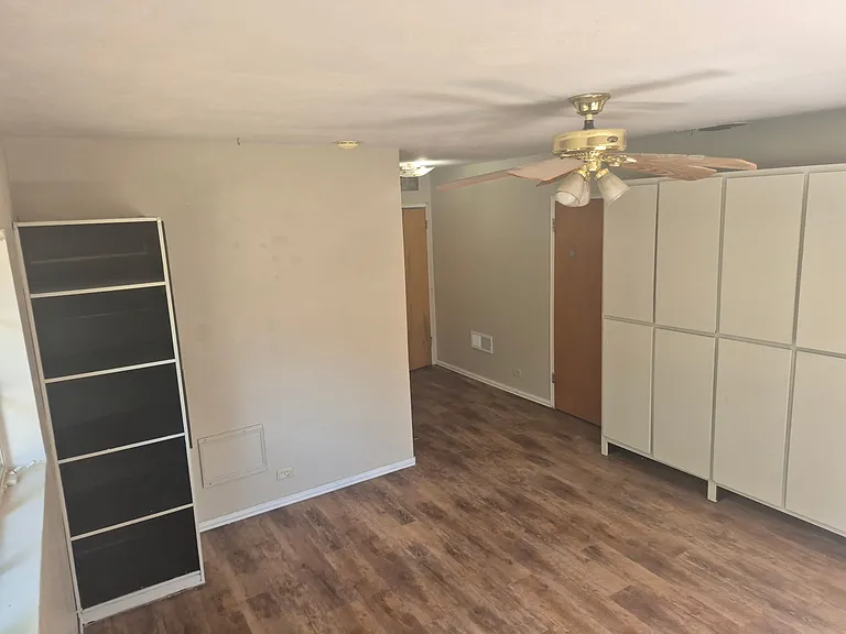 Master bedroom. View from corner shown in previous photo. Showing built-in cabinets.