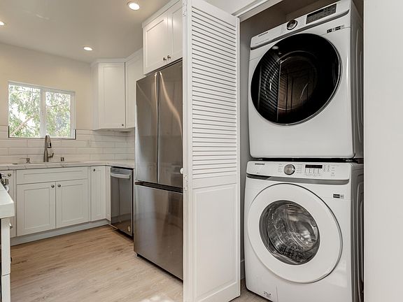 Kitchen with in unit washer and dryer