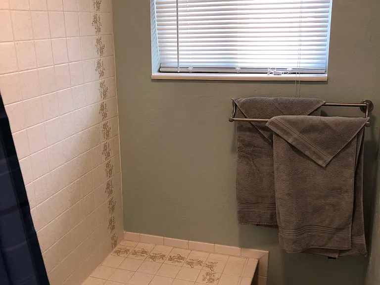 Full sized tub shower combination. Towels provided upon request