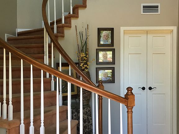 Curved staircase in foyer