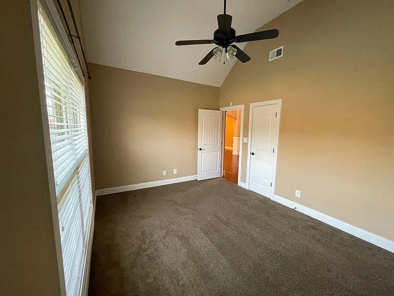 Versatile main level first floor bedroom perfect for a nursery, home office, or guest suite.