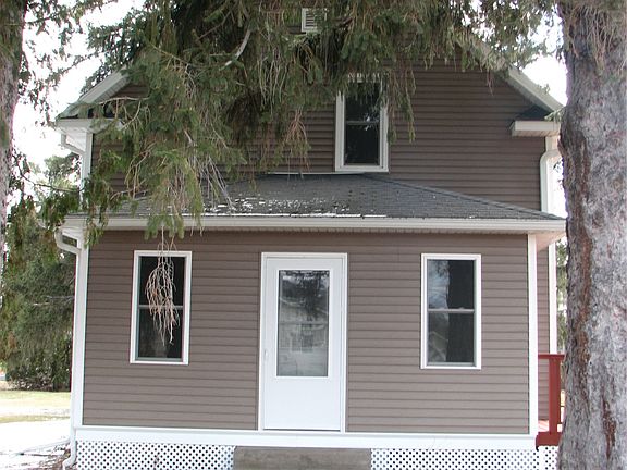 Front of house, mature pine trees