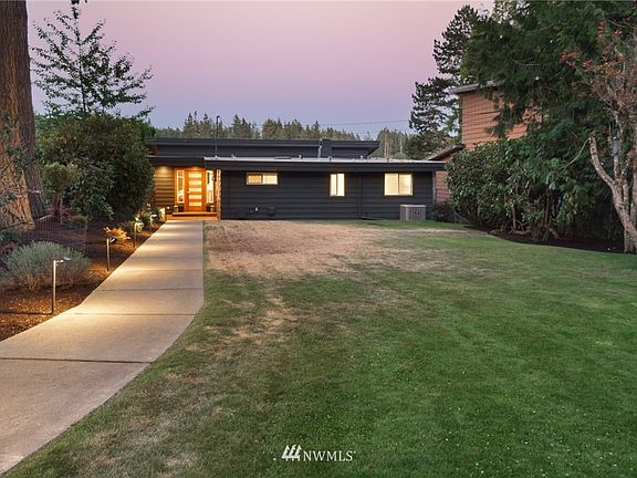 Well-planned landscapes, concrete pathways & custom lighting. 
