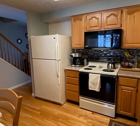 Cabinets equipped with dishware, cooking utensils, and basic spices