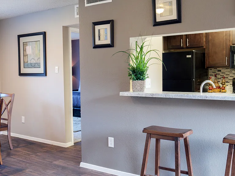 Spacious Dining Area with Kitchen View in Carrollton Apartments