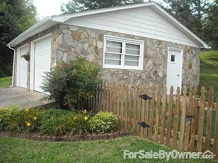 24X24 garage with built-in storage. Convenient access from fenced-in yard.